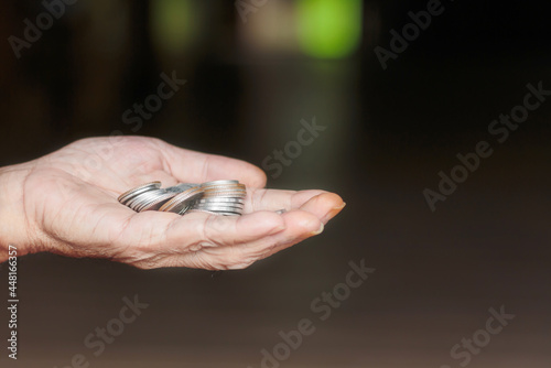 Tableau sur toile A handful of coins in the  hand