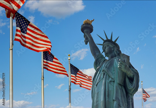 Statue of Liberty on the background flag United States New York, US © ungvar