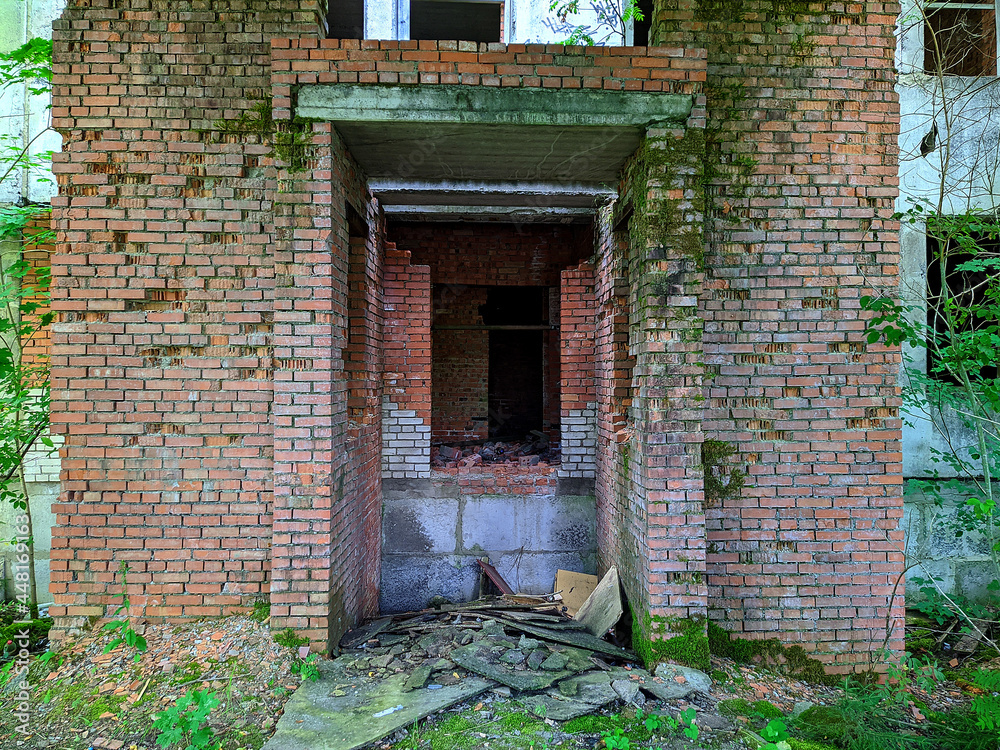 old and destroyed brick building in the forest.