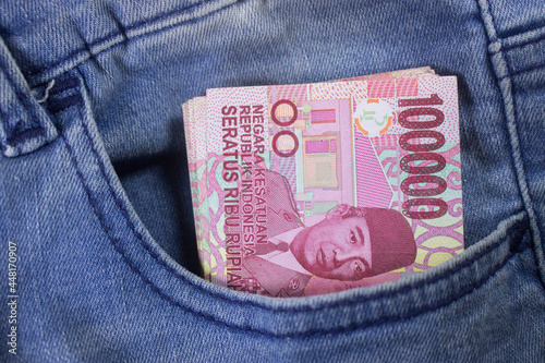 rupiah money inside of jeans pocket indonesia currency