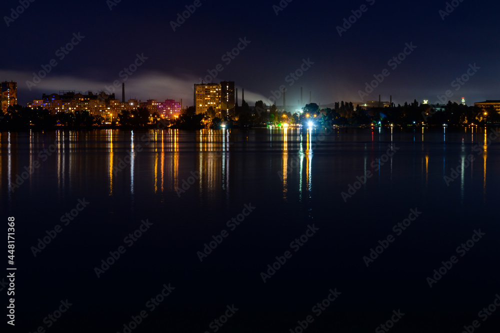 View on a river Dnieper and city Dnipro at night