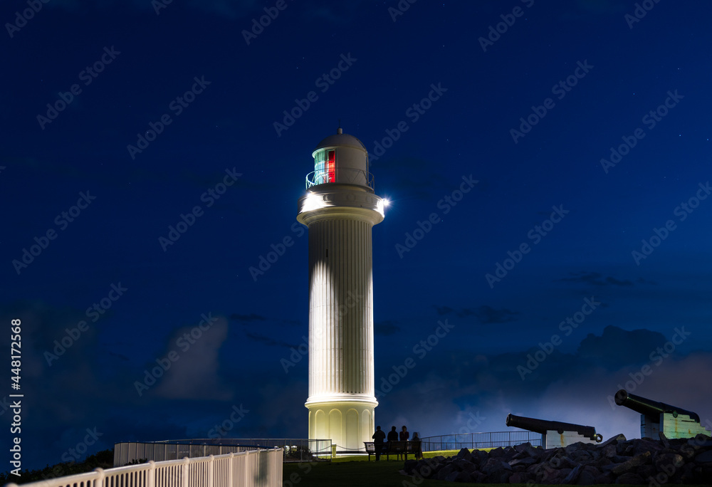 Lighthouse on the coast at night