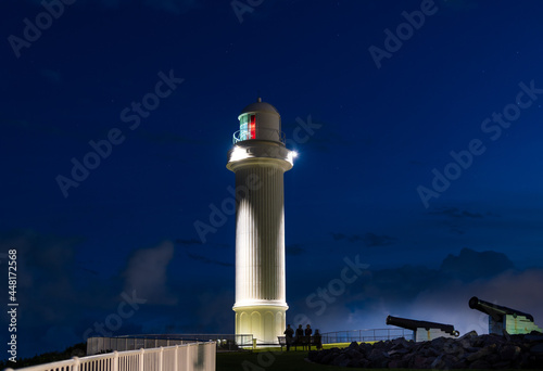 Lighthouse on the coast at night