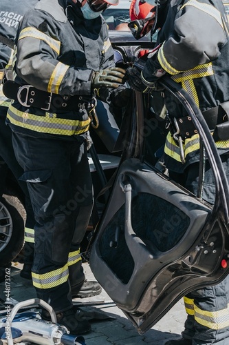 A training event to rescue victims of a car accident, firefighte