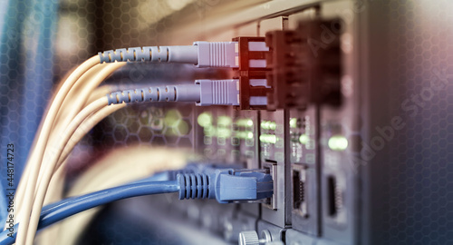 Fiber Optic cables connected to optic ports and UTP, Network cables connected to ethernet ports