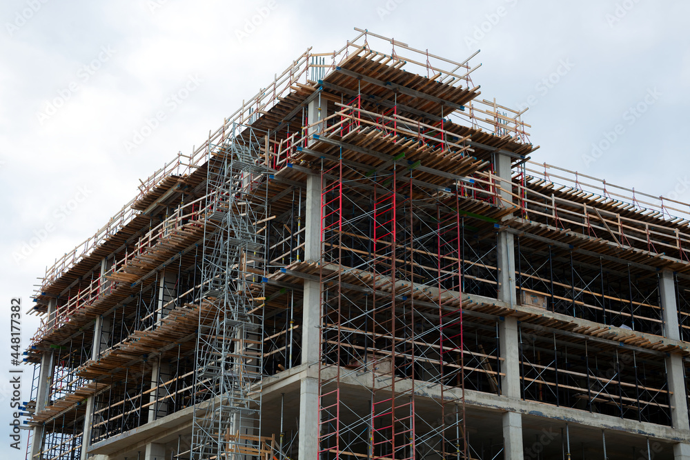 under construction site concrete building metal skeleton skyscraper structure