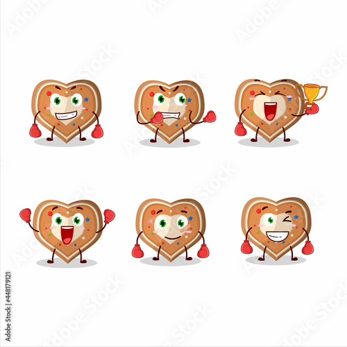 A sporty gingerbread heart boxing athlete cartoon mascot design © kongvector