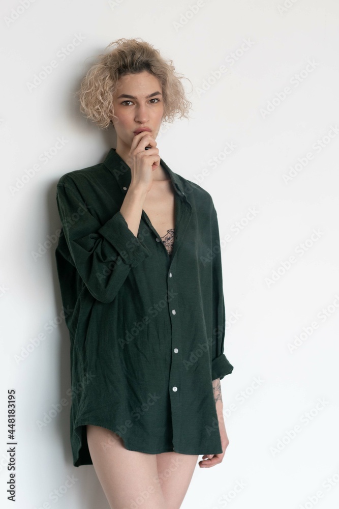 young beautiful woman posing in the studio, smoking a wipe young beautiful woman posing in the studio, smoking a wipe