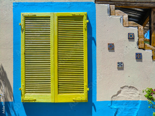 Colorful doors and windows of the restaurant pizzeria inside the swimming pool center in Olmedo, summer 2021, Sassari, Sardinia, Italy photo