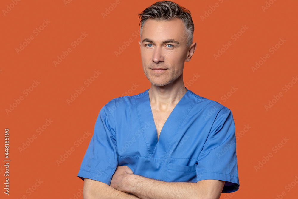 Man in blue suit with folded hands Man in blue suit with folded hands