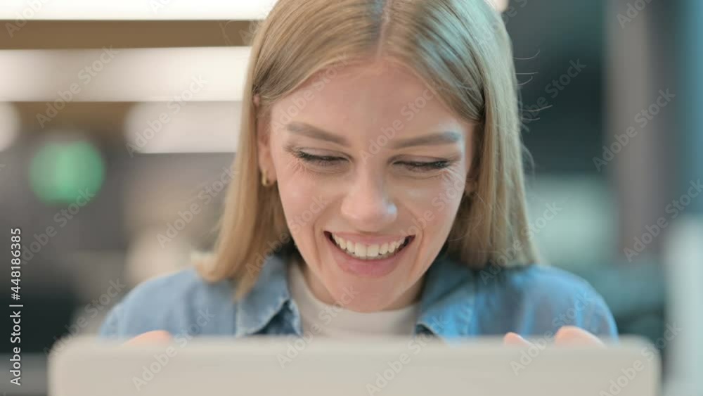 Close Up of Woman Celebrating Success on Laptop