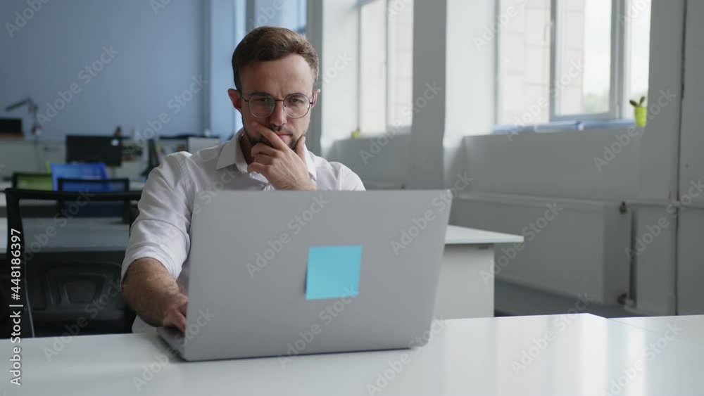 Office worker thinks about his online work Office worker thinks about his online work