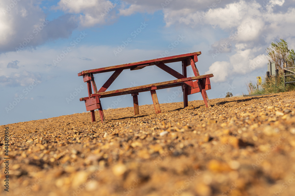 A picnic bench and table on Heacham South Beach, Norfolk, England, UK A picnic bench and table on Heacham South Beach, Norfolk, England, UK