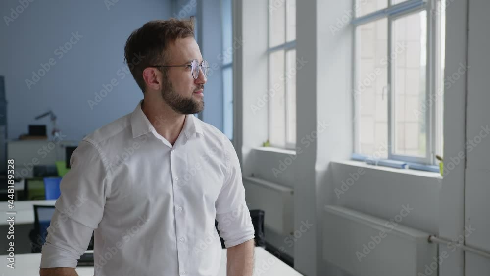 Happy man stand in glasses and look on the camera Happy man stand in glasses and look on the camera