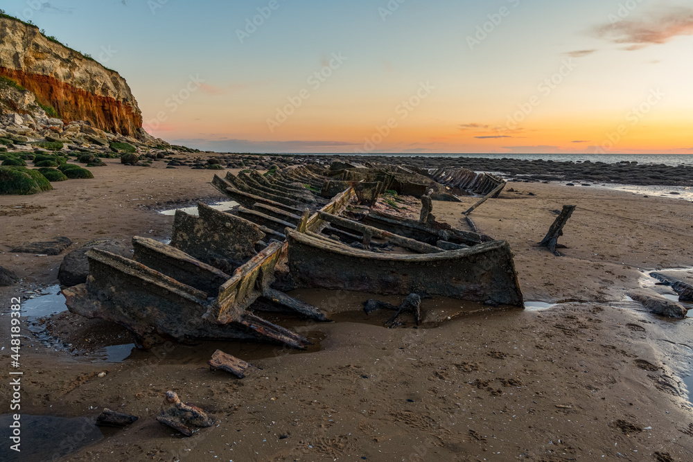 The Wreck of the Steam Trawler Sheraton in the evening light at the Hunstanton Cliffs in Norfolk, England, UK The Wreck of the Steam Trawler Sheraton in the evening light at the Hunstanton Cliffs in Norfolk, England, UK