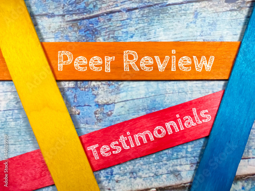 Business concept.Text Peer Review Testimonials writing on colored ice cream stick on a wooden background. photo