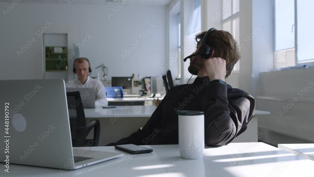 Slow motion of a young worker in company office Slow motion of a young worker in company office