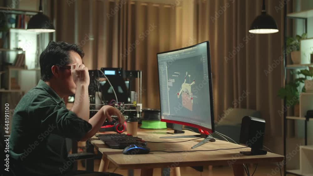 Frustrated Asian Engineer Working On Personal Computer And 3D Printer, Screen Shows Cad Software With 3D Prototype Of Drone Delivery
Frustrated Asian Engineer Working On Personal Computer And 3D Printer, Screen Shows Cad Software With 3D Prototype Of Drone Delivery