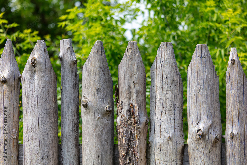 A fence made of wooden logs A fence made of wooden logs