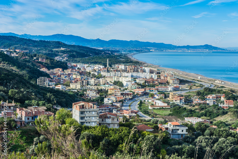 Naklejka premium Small village with morning in state of Jijel, Algeria, rural village, A beautiful Mediterranean village in North Africa, Algeria from above, A small town overlooking the Mediterranean sea.
