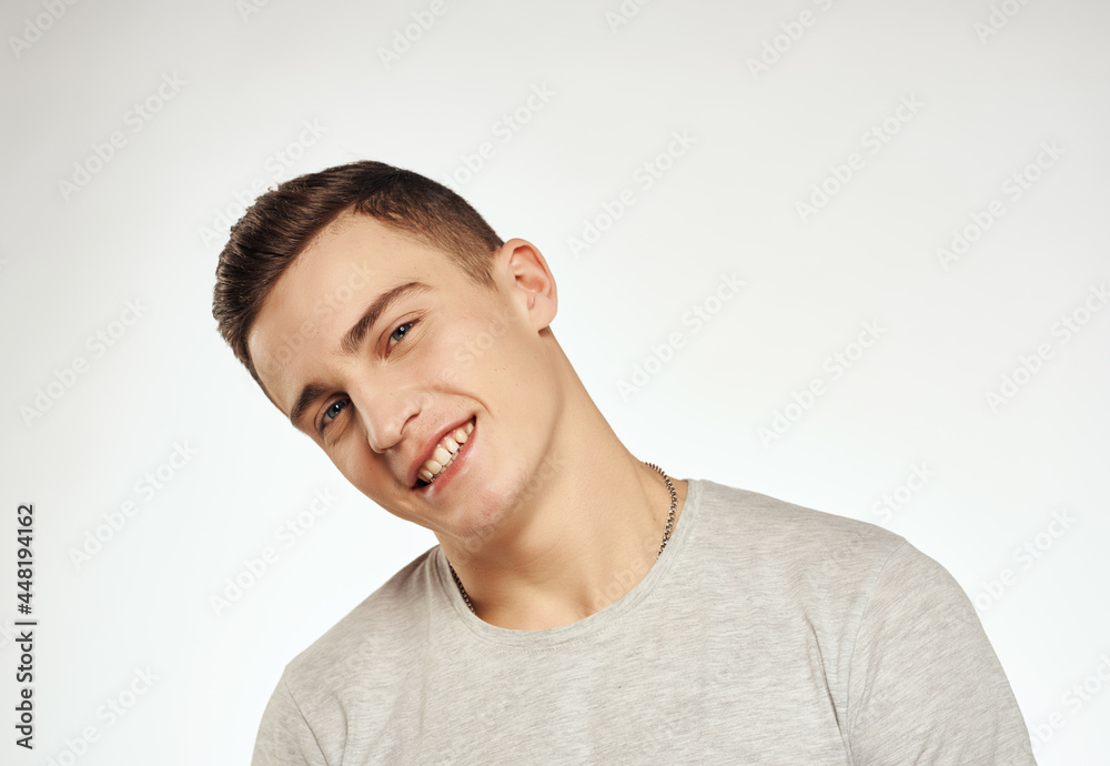 man t shirts close-up studio smile isolated background