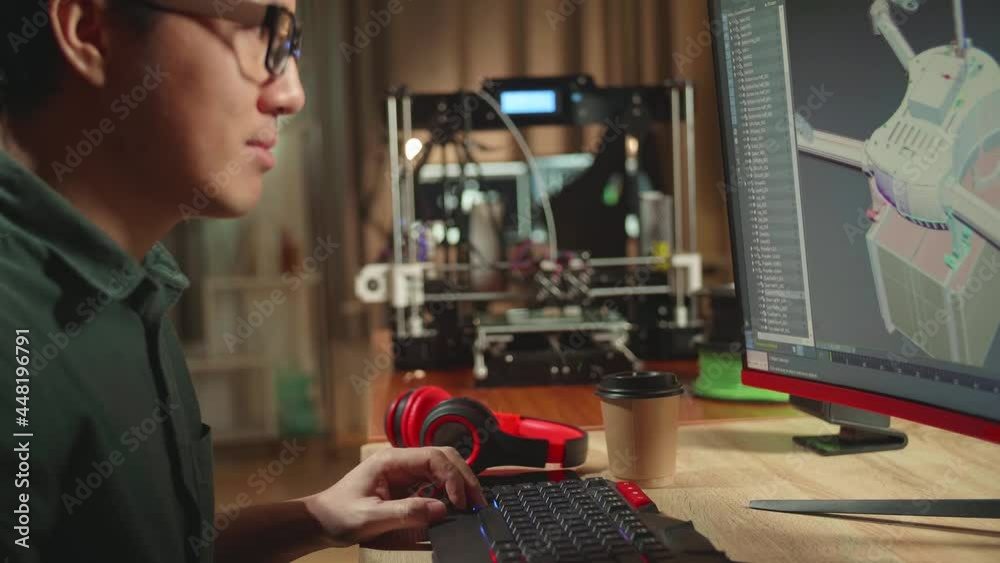 Asian Engineer Working On Personal Computer And 3D Printer, Screen Shows Cad Software With 3D Prototype Of Drone Delivery
