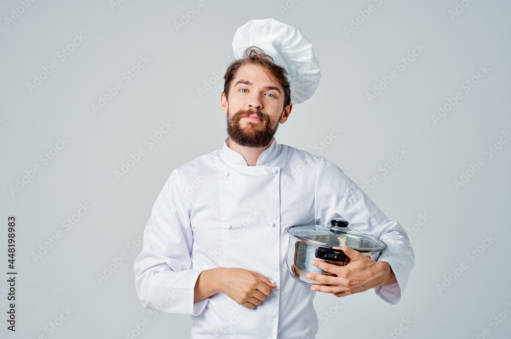 male chef with a saucepan in his hands cooking food kitchen lifestyle male chef with a saucepan in his hands cooking food kitchen lifestyle