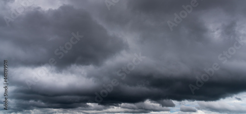 Overcast cloudy sky with dark cloud in windy day.