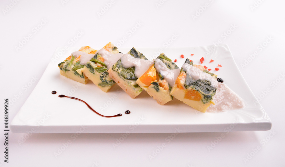 steamed egg pudding with pumpkin and vegetables with white coconut sauce in white background for Christmas festival menu steamed egg pudding with pumpkin and vegetables with white coconut sauce in white background for Christmas festival menu