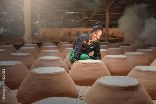 potter making pot in pottery workshop photo