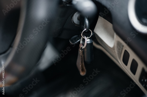 Car key into ignition lock. close up