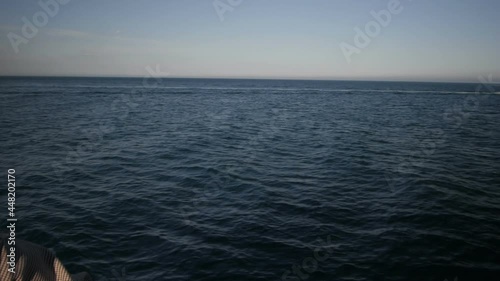 Slow motion video as a girl looks into the distance sea sunset