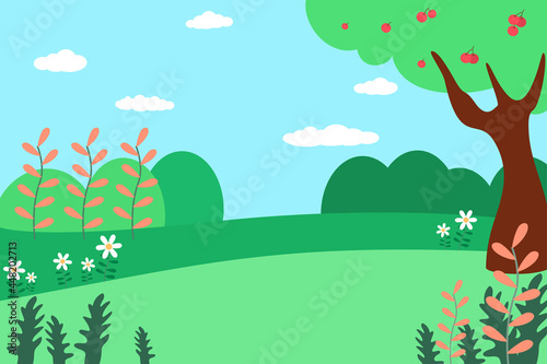 Spring landscape in the park. Green meadows and white flowers.The tree is full of fruits.