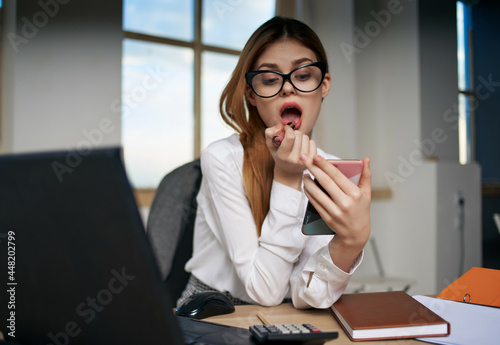 secretary sitting in front of laptop office technology professional