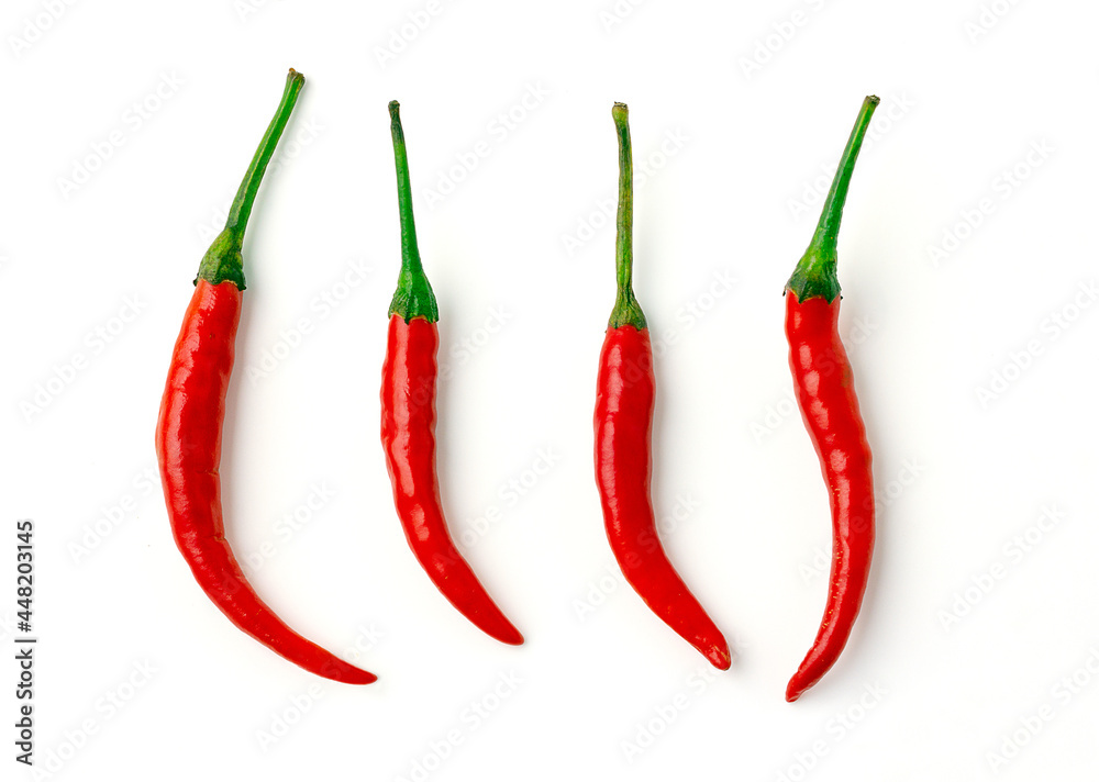 4 Red hot chili pepper with green stalk isolated on a white background. Group of red chili. top view.