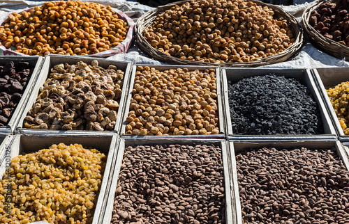 dried fruits and dried berries, pine nuts on the market photo