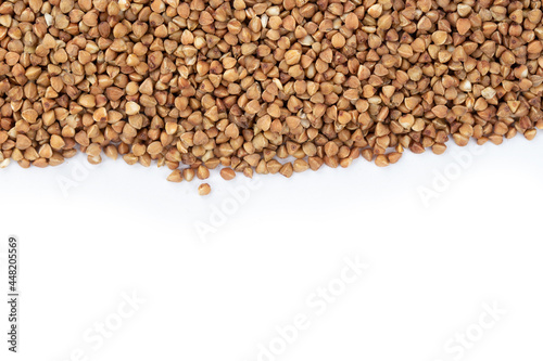 Buckwheat on white background. Top view. Buckwheat. Stockpiling. Buckwheat grains. Grain culture. Pandemic.