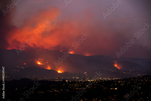 Obraz na płótnie A nighttime wildfire tears through the hills of California. w salonie