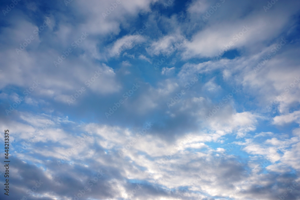 Cumulus clouds against the blue sky. Template for the designer