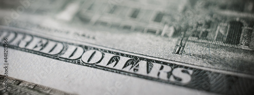 Money banner, macro photograph of one hundred US dollar banknote. Business and finance concept. Selective focus.