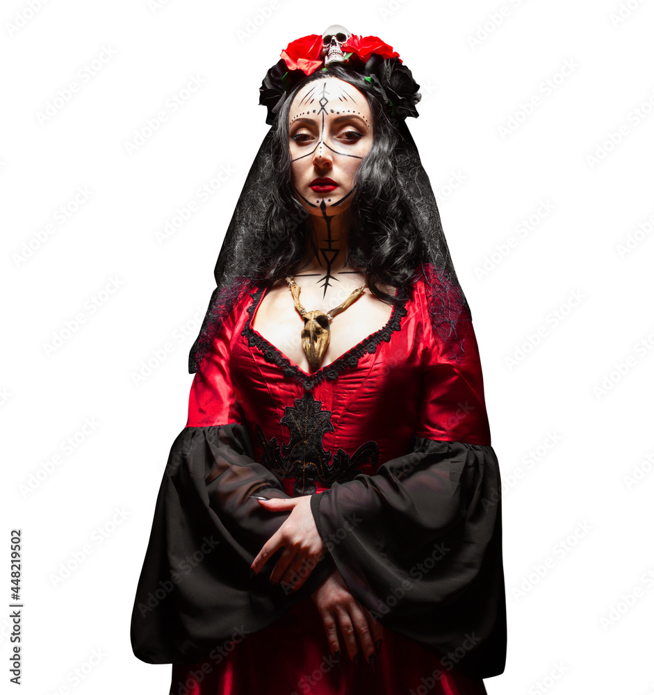 Isolated photo of mysterious woman, witch with runic makeup in red gothic dress, crown with skull and roses and wooden animal skull amulet. Halloween concept.