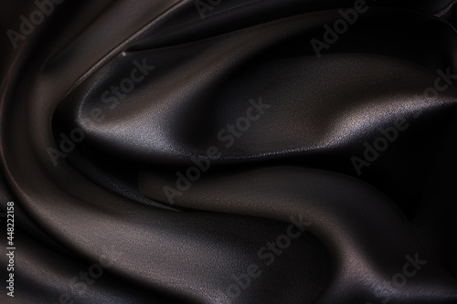 Texture, background, pattern. Brown synthetic fabric for tailoring. Imitation leather. photo