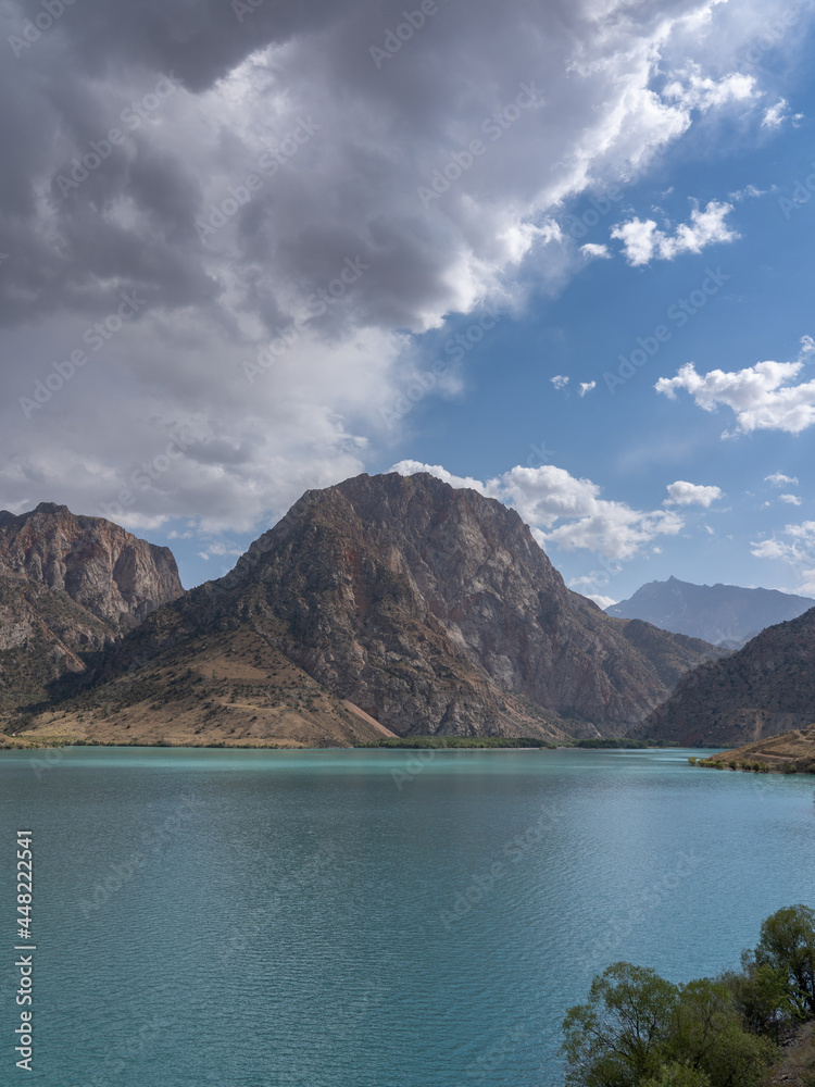 Scenic vertical landscape view of popular landmark Iskanderkul lake, Fann mountains, Sughd, Tajikistan