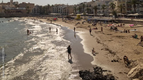 People on beach, Stiges, near Barcelona, Spain photo