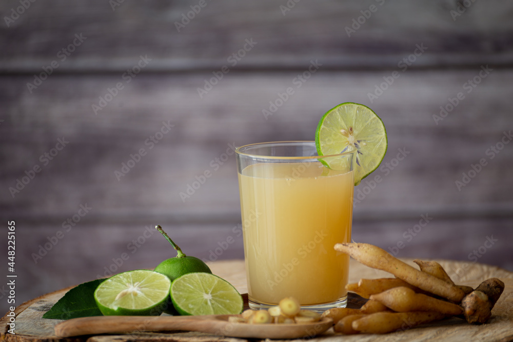 Fototapeta premium Kaempfer juice on a wooden table