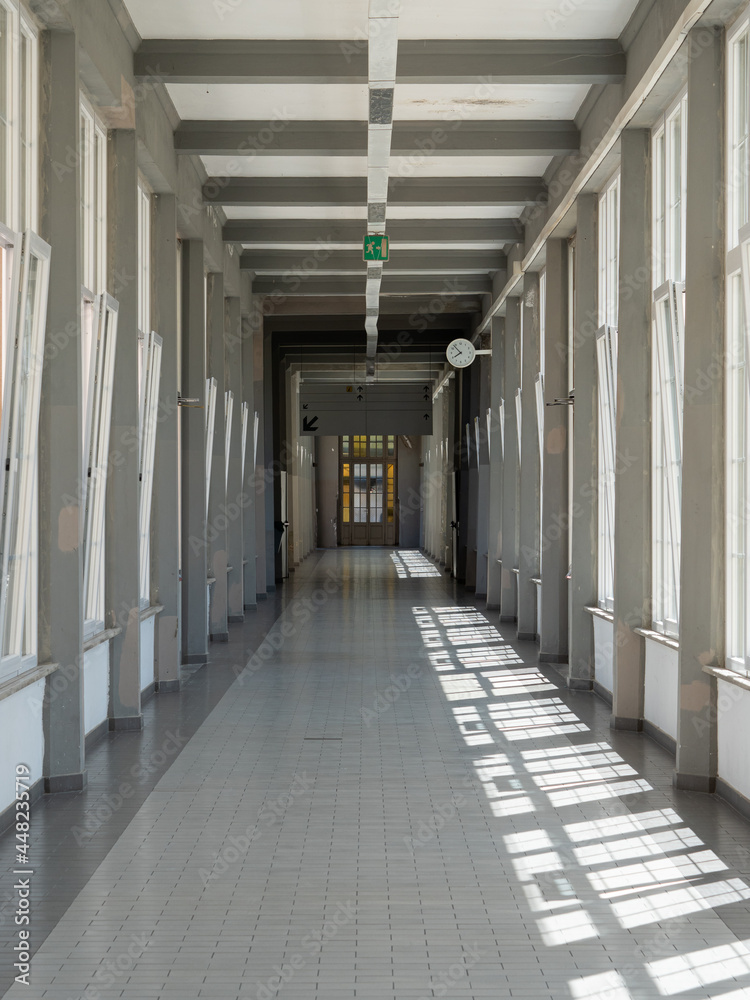 Long interior Corridor of a Hospital with Large Windows