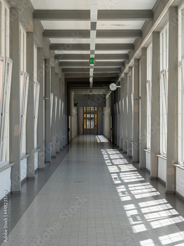 Long interior Corridor of a Hospital with Large Windows