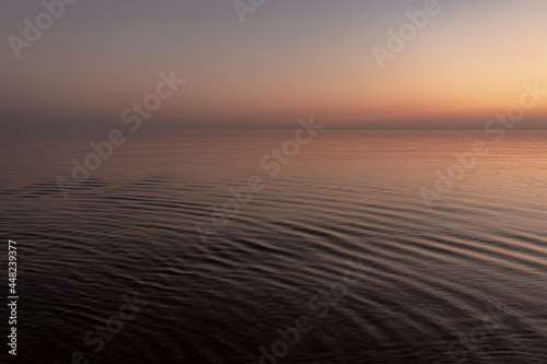 sunset sun by the ocean  clear water and sandy azure beach