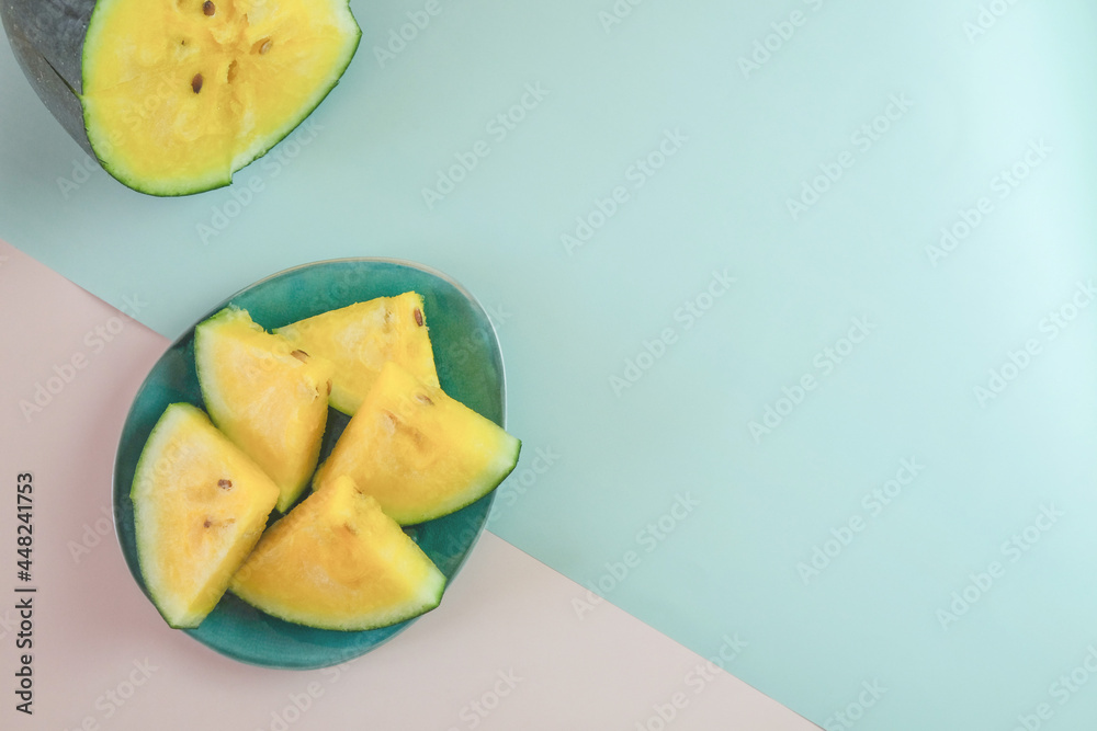 Yellow watermelon on a pink and green background.
Creative background of summer fruits. Food concept. Flat lounger, top view, copy space
Sectional seasonal fruits. Fresh fruit harvest.