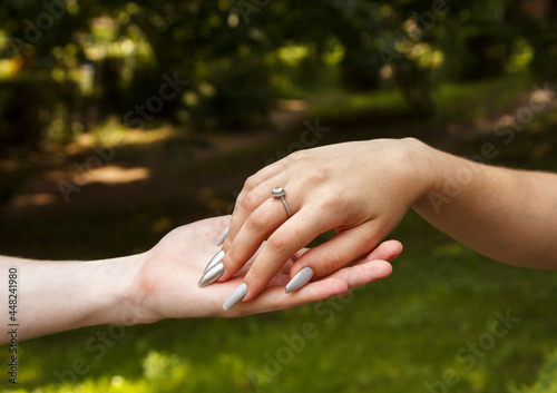 man and woman hold hands. hands closeup © Radnatt